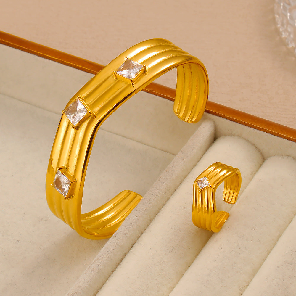 Women’s Titanium Steel Bangle With Golden Plated Finish And Zircon Inlay Featuring Elegant Line Pattern