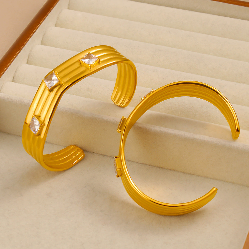 Women’s Titanium Steel Bangle With Golden Plated Finish And Zircon Inlay Featuring Elegant Line Pattern
