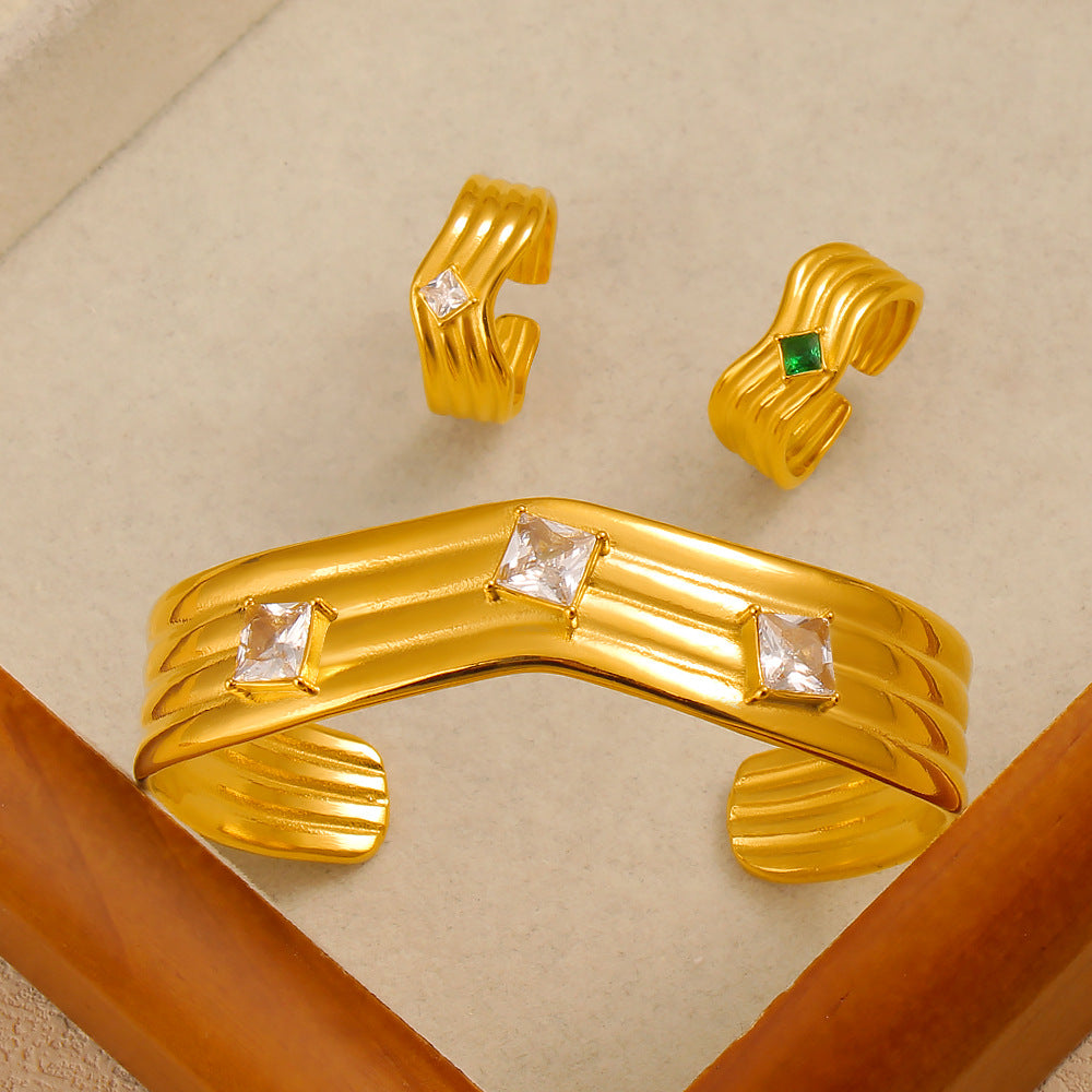 Women’s Titanium Steel Bangle With Golden Plated Finish And Zircon Inlay Featuring Elegant Line Pattern