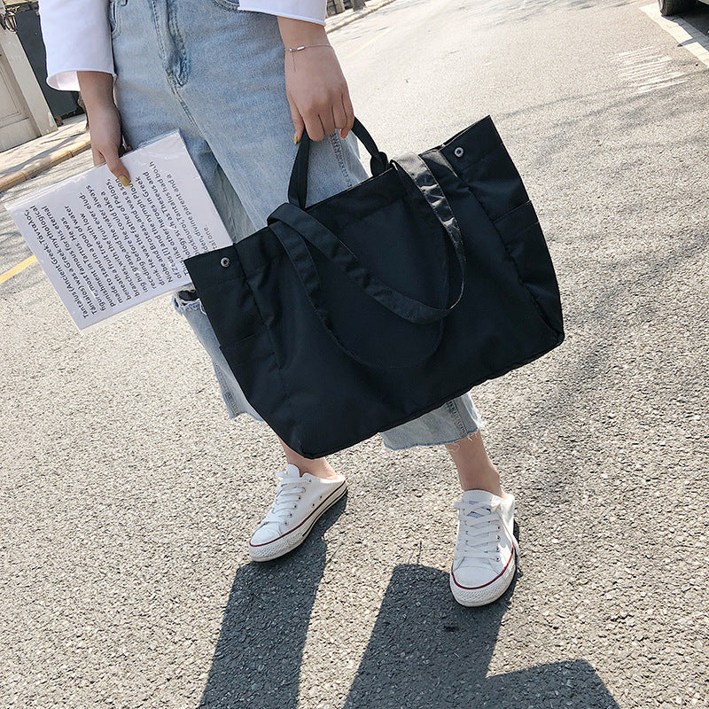 fashionable hand-held single-shoulder bag