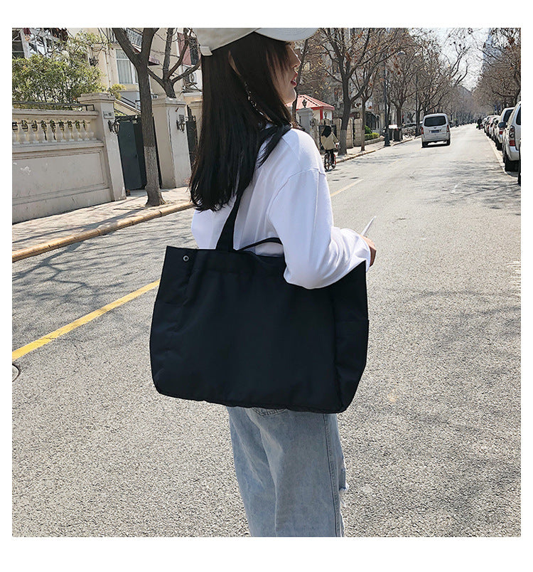 fashionable hand-held single-shoulder bag