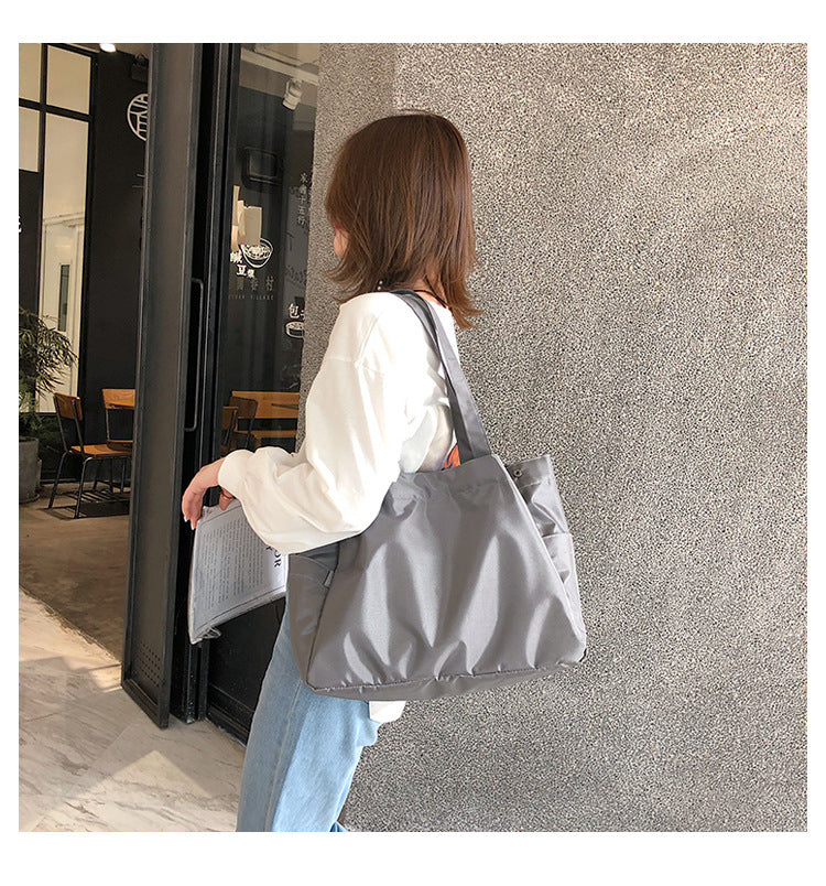 fashionable hand-held single-shoulder bag