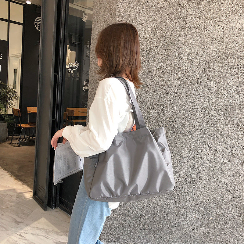 fashionable hand-held single-shoulder bag