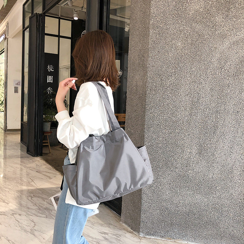 fashionable hand-held single-shoulder bag