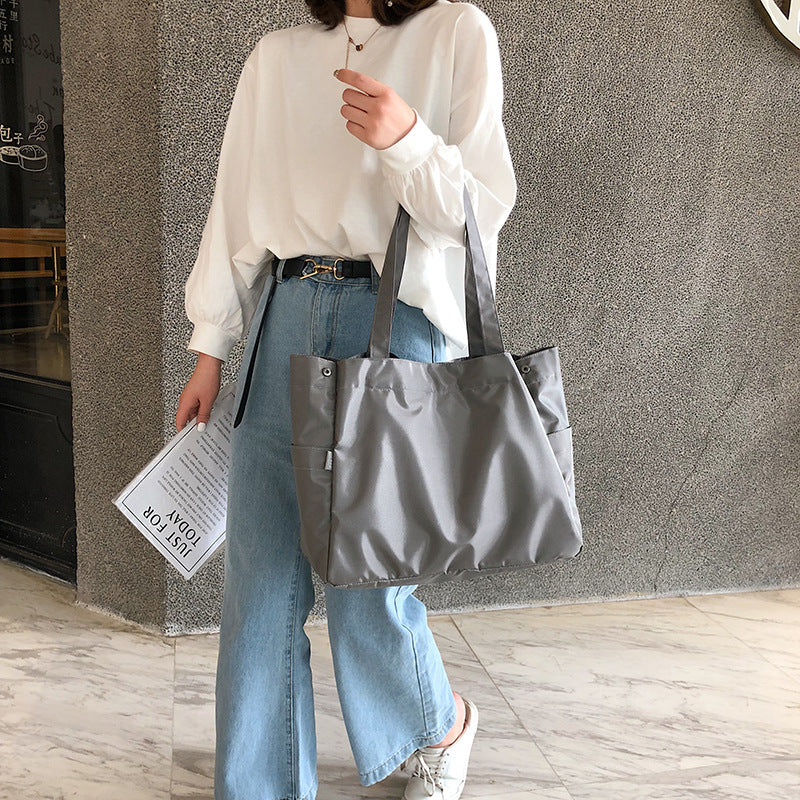 fashionable hand-held single-shoulder bag
