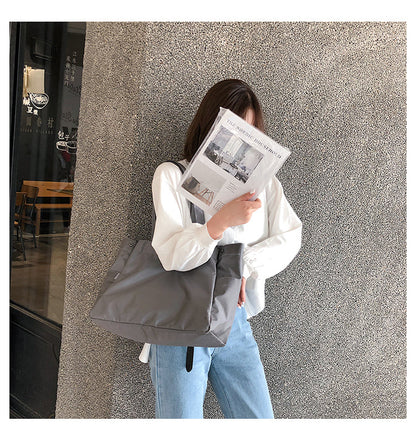 fashionable hand-held single-shoulder bag