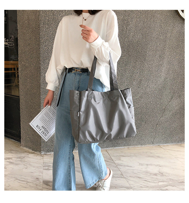 fashionable hand-held single-shoulder bag