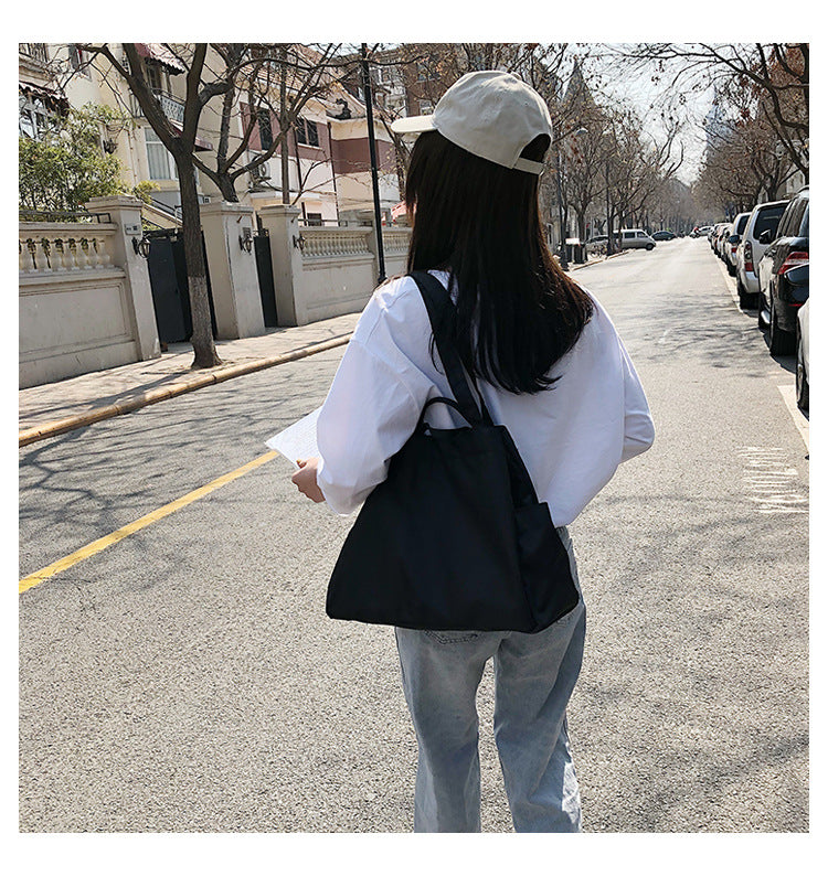 fashionable hand-held single-shoulder bag