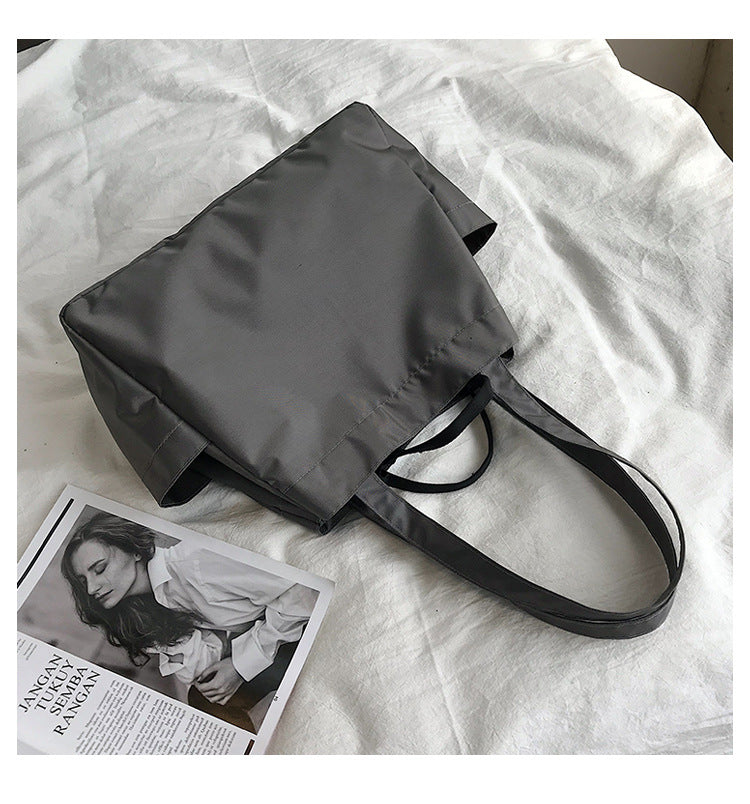 fashionable hand-held single-shoulder bag