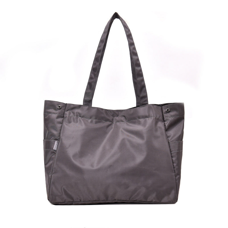 fashionable hand-held single-shoulder bag