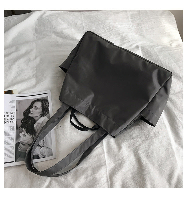 fashionable hand-held single-shoulder bag