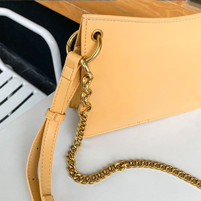 Leather one-shoulder slanted gold lock bag