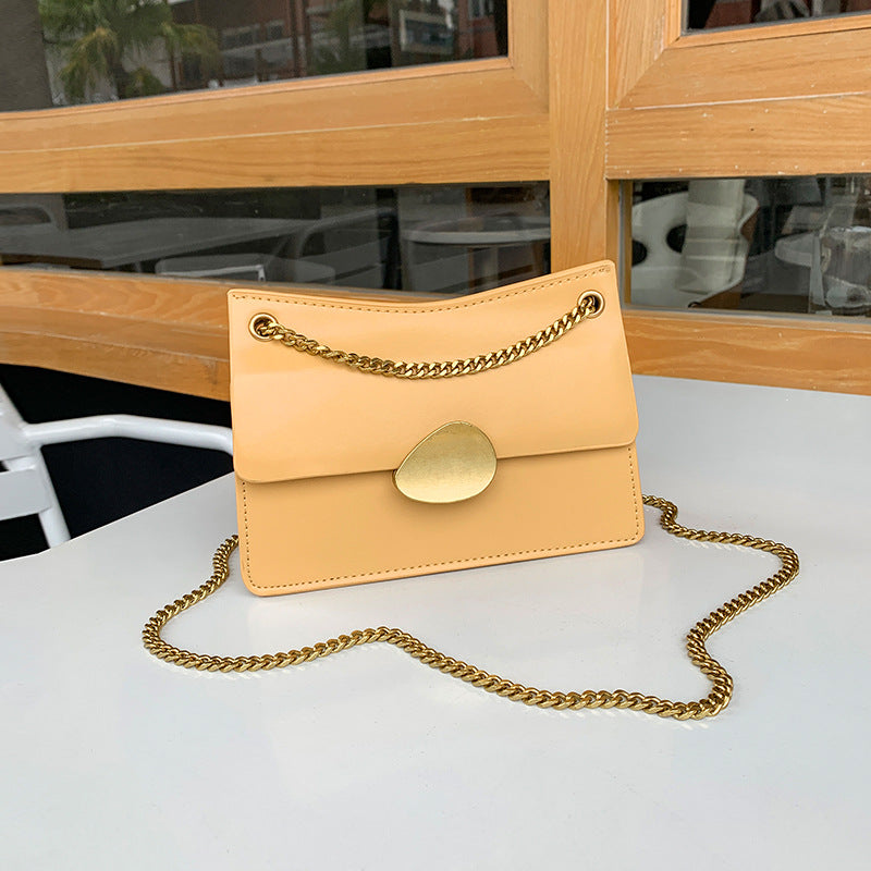 Leather one-shoulder slanted gold lock bag