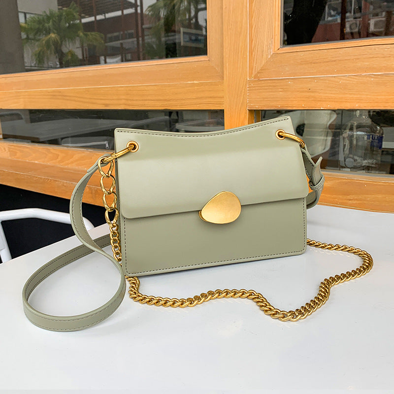 Leather one-shoulder slanted gold lock bag