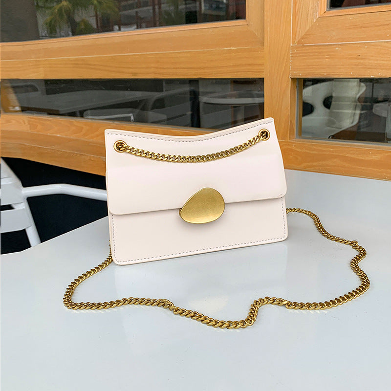 Leather one-shoulder slanted gold lock bag