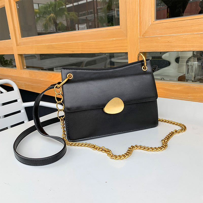 Leather one-shoulder slanted gold lock bag