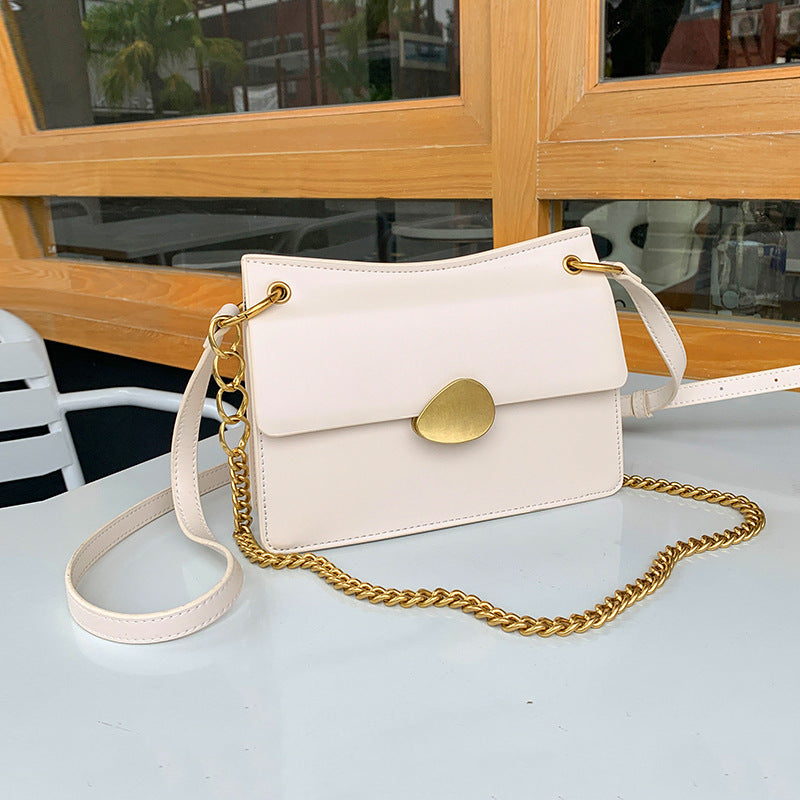 Leather one-shoulder slanted gold lock bag