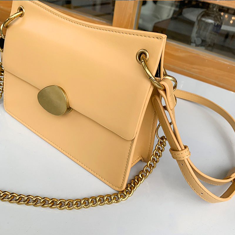Leather one-shoulder slanted gold lock bag