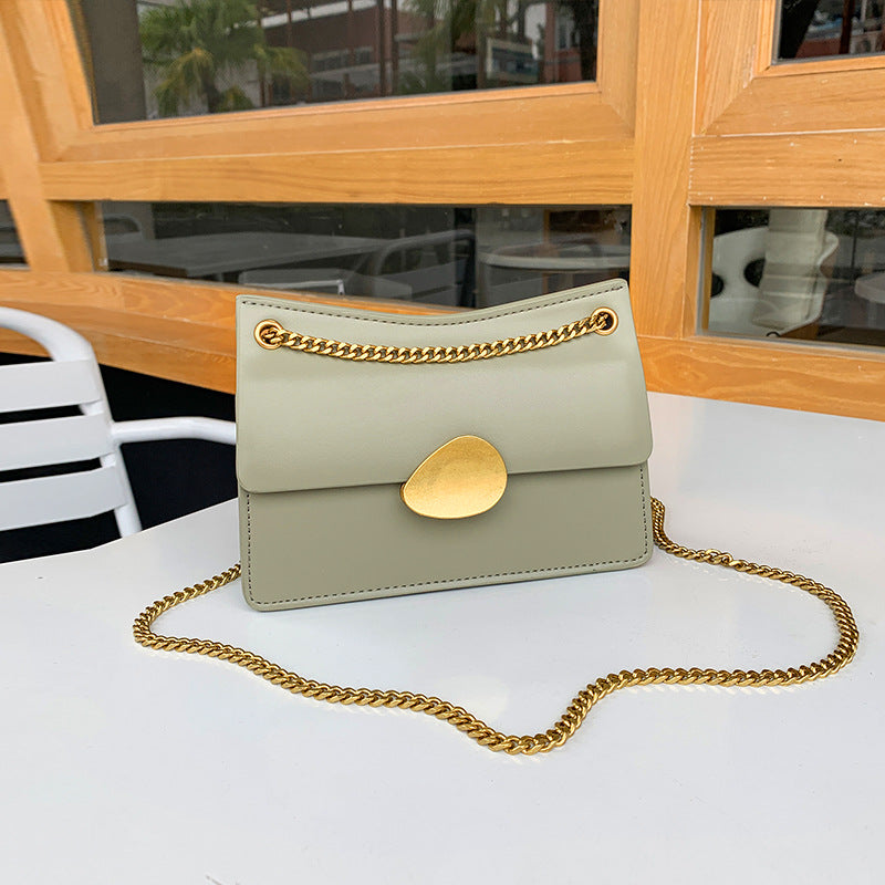 Leather one-shoulder slanted gold lock bag