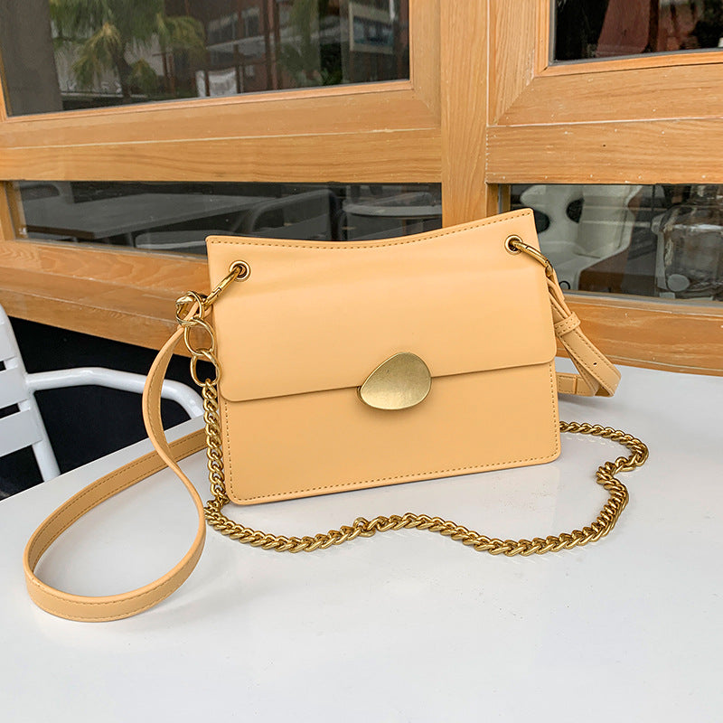 Leather one-shoulder slanted gold lock bag