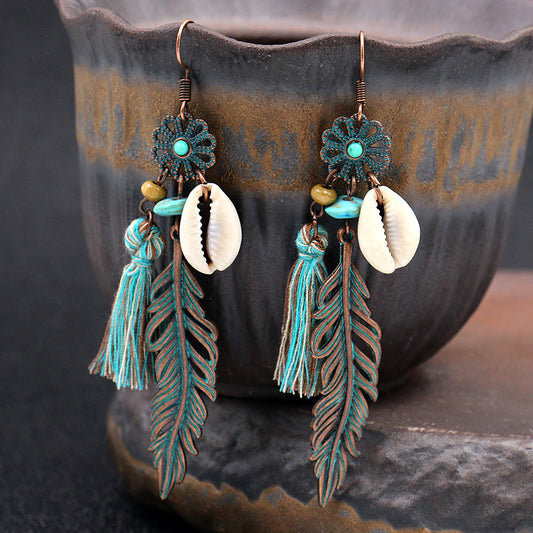 Fashion hollow carved alloy tassel earrings