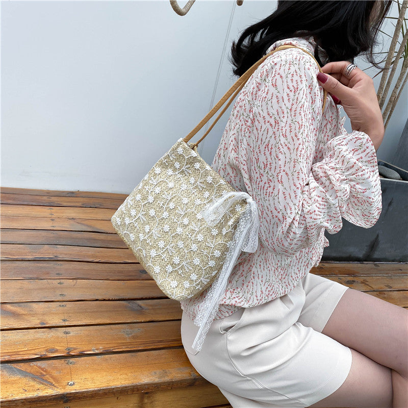 Large capacity bucket hand-held straw woven women's bag