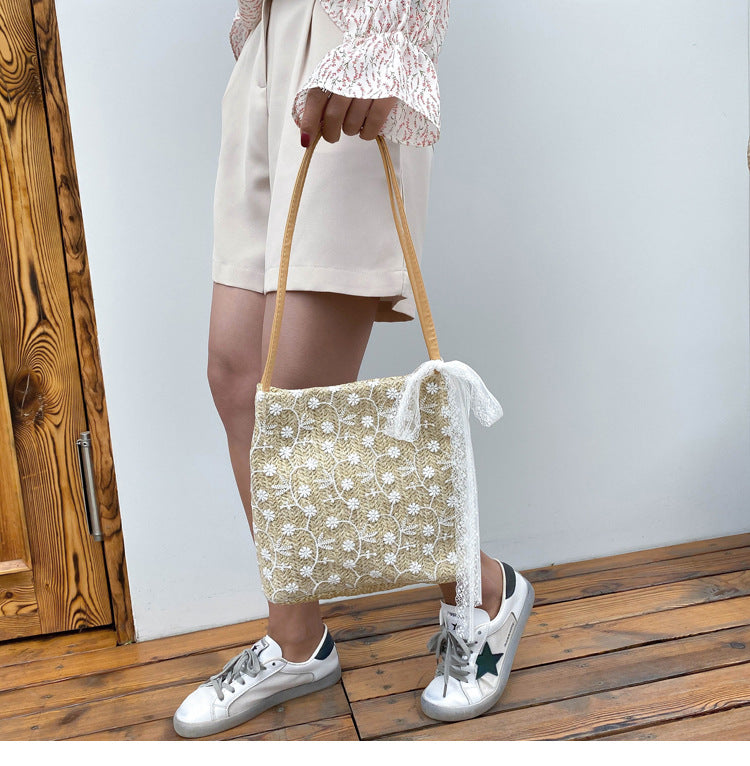 Large capacity bucket hand-held straw woven women's bag