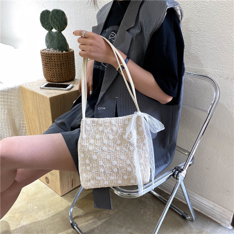 Large capacity bucket hand-held straw woven women's bag