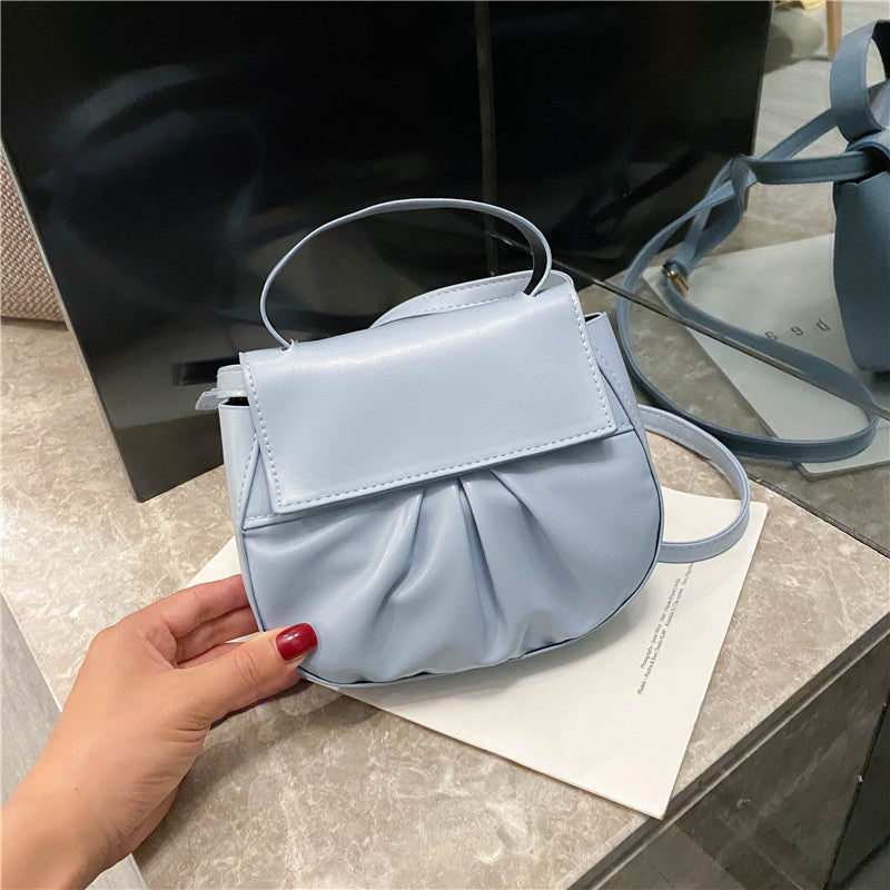Pleated portable one shoulder cross saddle bag