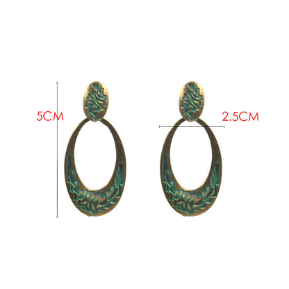 Retro oval hollow alloy pendant