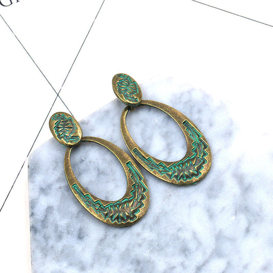 Retro oval hollow alloy pendant