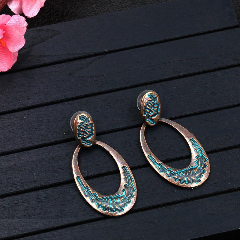 Retro oval hollow alloy pendant