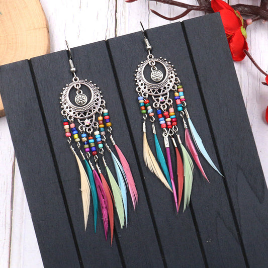 Round hollow feather tassel earrings