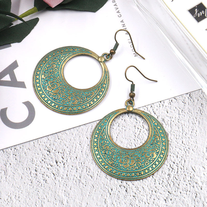 Round hollow vintage alloy earrings