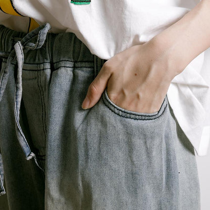 Frayed Solid Color Drawstring Casual Jeans