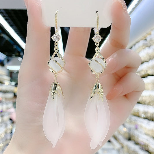 Long fringed opal white petal earrings