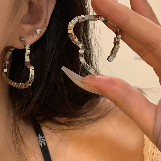 Broken silver love earrings