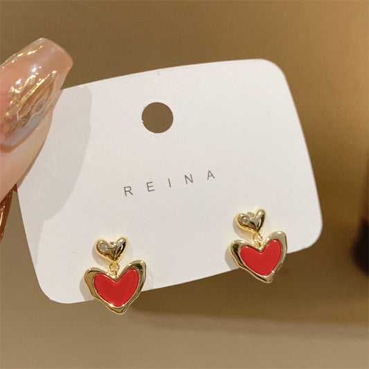 Simple and small red love earrings