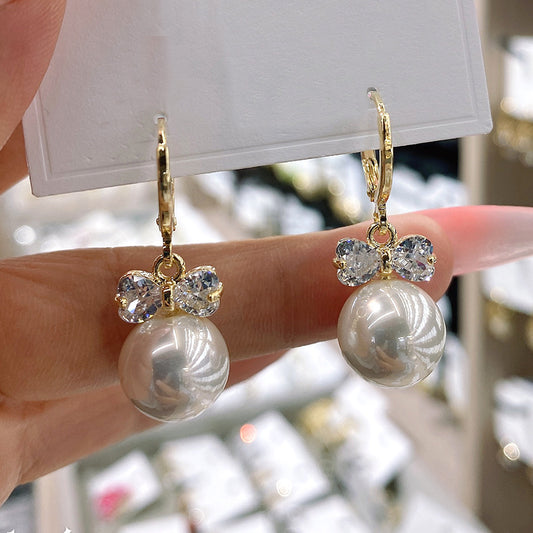 Zircon bow pearl earrings