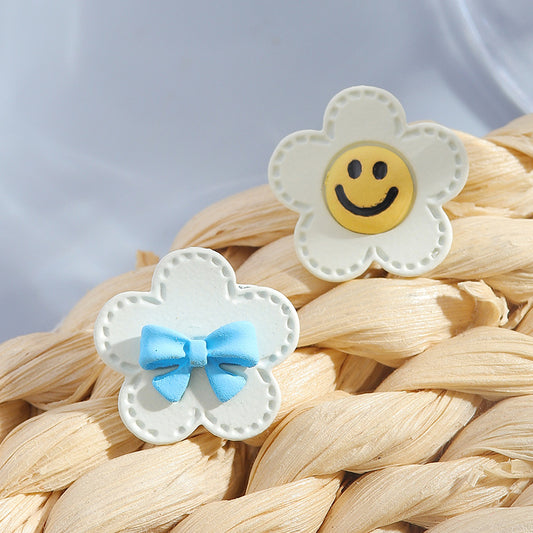 S925 silver needle white flower bow smiley earrings